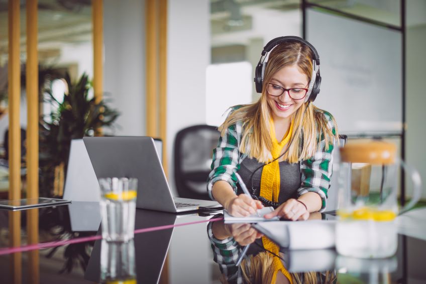 woman working from home with headphones on